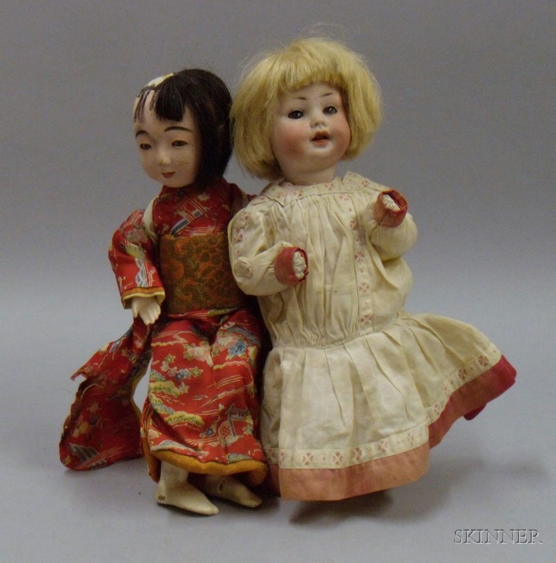 Appraisal: Two Dolls th century bisque character baby impressed PM with