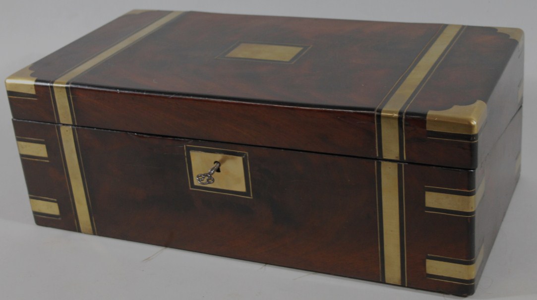 Appraisal: An early thC flame mahogany and brass bound campaign writing