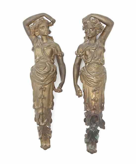 Appraisal: A Pair of Cast Bronze Figural Curtain Tiebacks each depicting