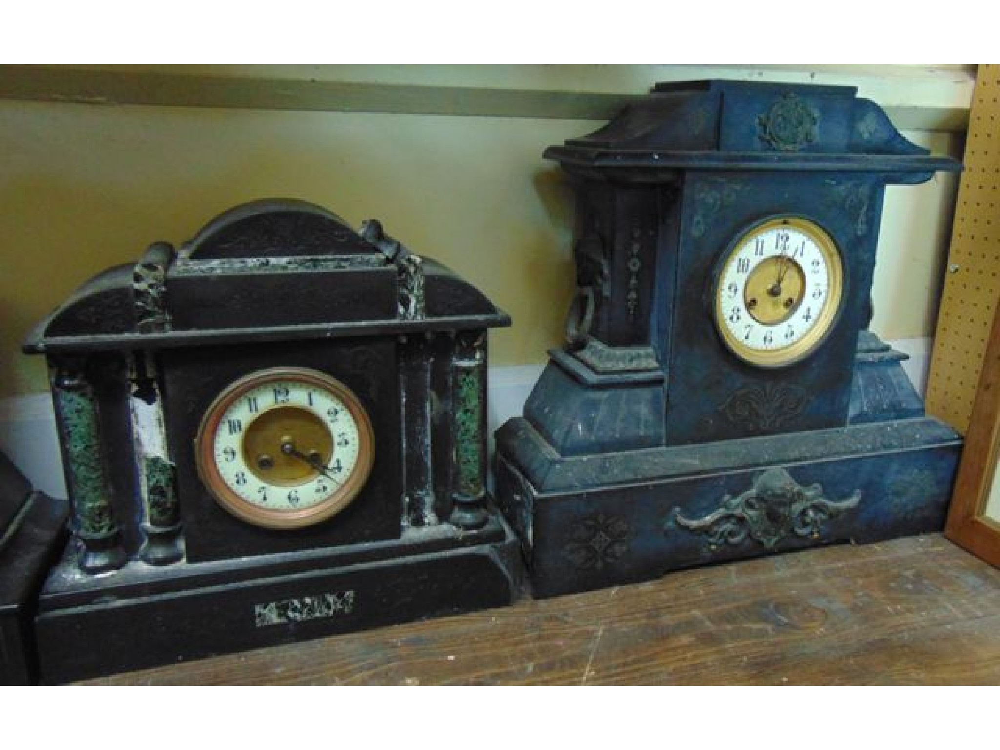 Appraisal: A Victorian black mantle clock with applied detail and eight