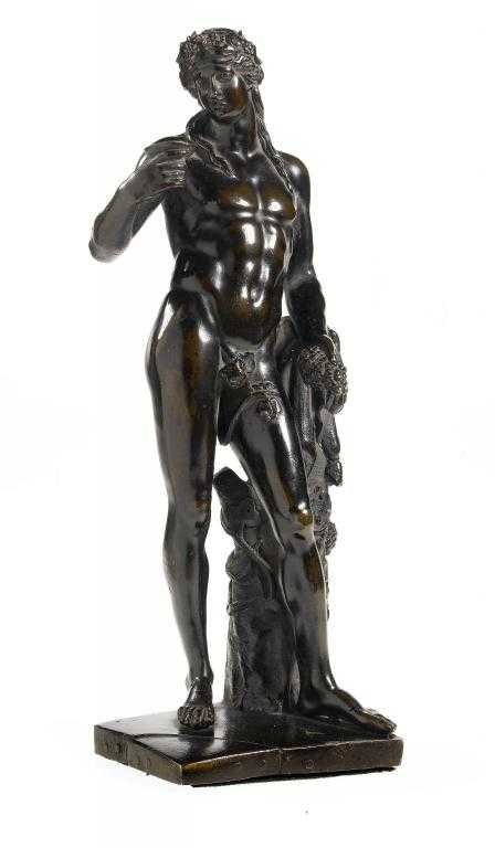 Appraisal: A BRONZE STATUETTE OF THE YOUTHFUL BACCHUS a cup in