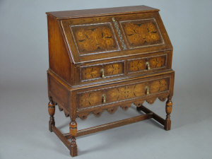 Appraisal: An oak and inlaid bureau early th century the fall