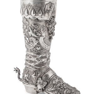 Appraisal: A German Hanau Silver Boot having extensive repousse scrollwork and