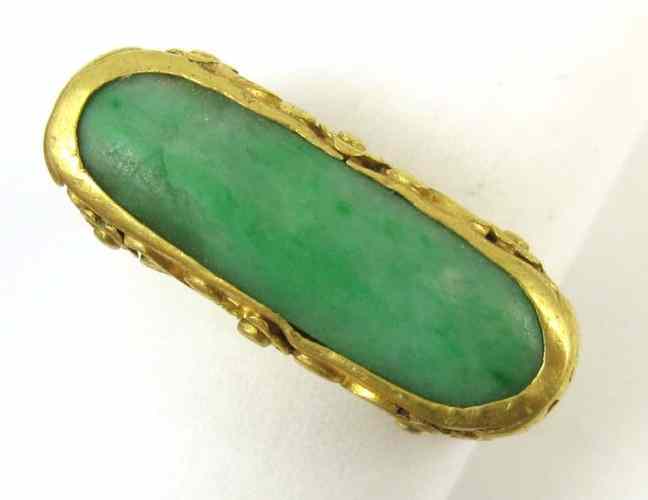 Appraisal: CHINESE JADE AND TWENTY-TWO KARAT YELLOW GOLD RING bezel set