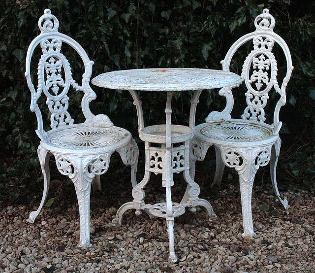 Appraisal: A WHITE PAINTED CAST ALUMINIUM CIRCULAR GARDEN TABLE with pierced