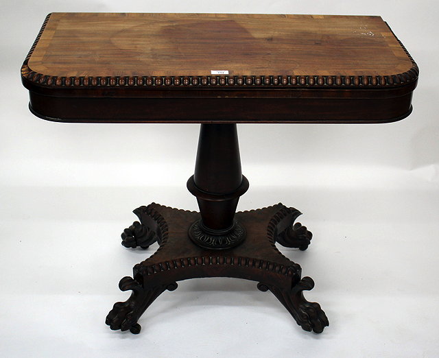 Appraisal: A GEORGE IV CROSSBANDED MAHOGANY TEA TABLE with carved decoration