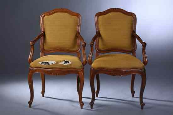 Appraisal: PAIR FRENCH PROVINCIAL STYLE FRUITWOOD FAUTEUILS Arched crest encompassing padded