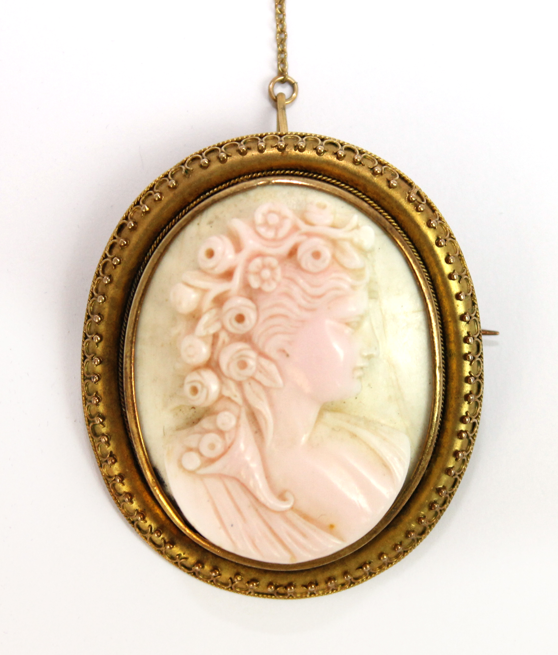 Appraisal: A Victorian carved pink shell cameo brooch designed as the