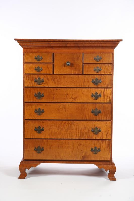 Appraisal: CHIPPENDALE-STYLE TALL CHEST American th century curly maple pine secondary