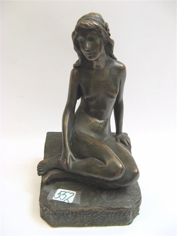 Appraisal: BRONZE CLAD FIGURE OF NUDE WOMAN SEATED raised on shaped