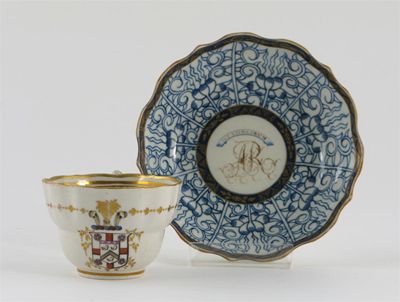 Appraisal: A Caughley teacup painted with an armorial below a delicate