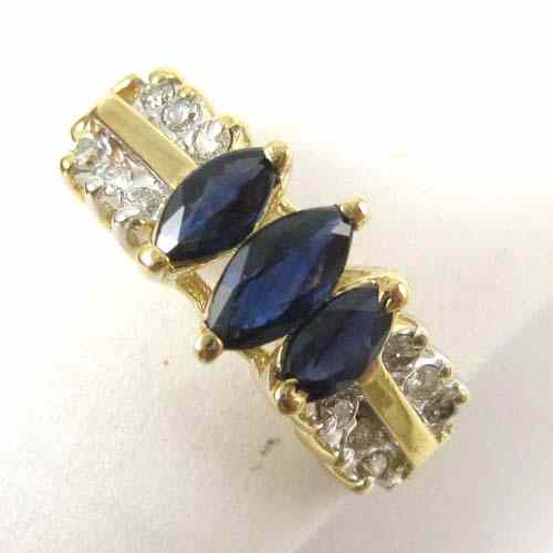 Appraisal: SAPPHIRE DIAMOND AND FOURTEEN KARAT GOLD RING The yellow gold