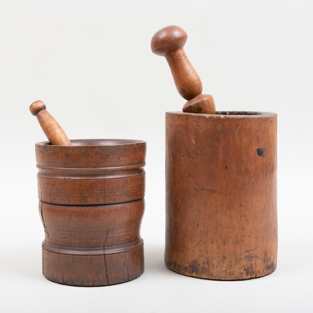 Appraisal: Two Carved Wood Mortars and Two Pestles The larger mortar