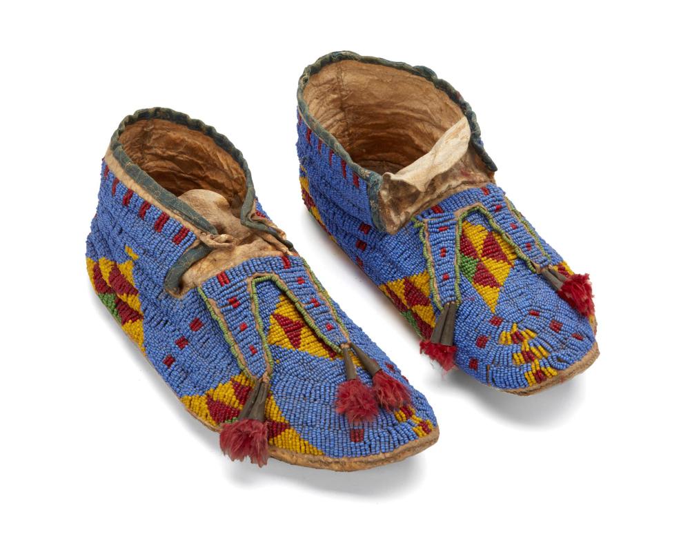 Appraisal: A pair of Plains Indian beaded hide moccasins th Century