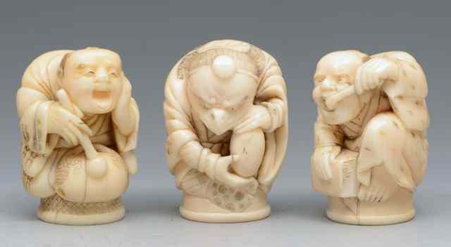 Appraisal: A COLLECTION OF THREE CARVED JAPANESE IVORY CANE HANDLES one