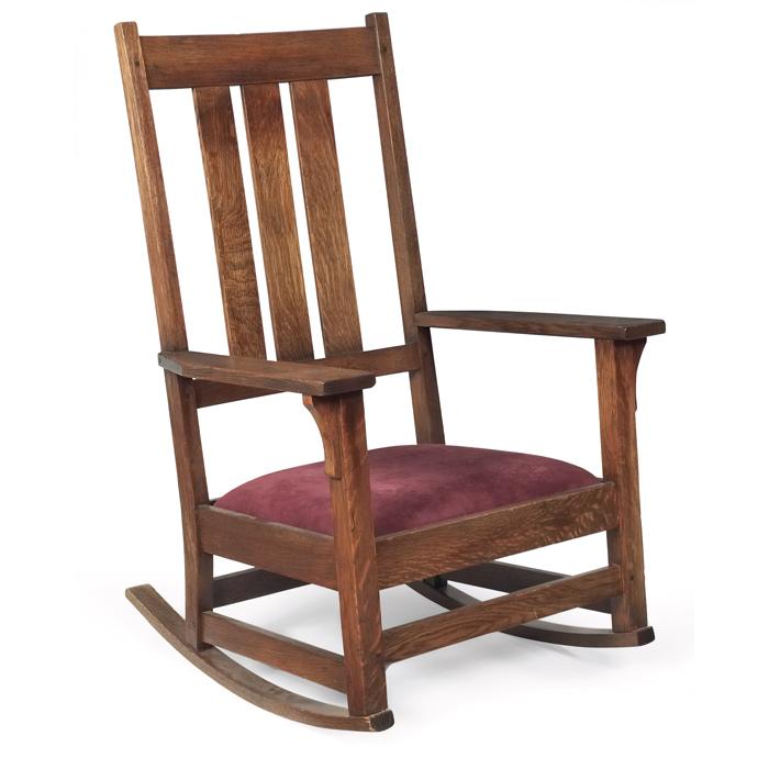 Appraisal: Gustav Stickley rocker high-backform with three vertical slats above arecovered