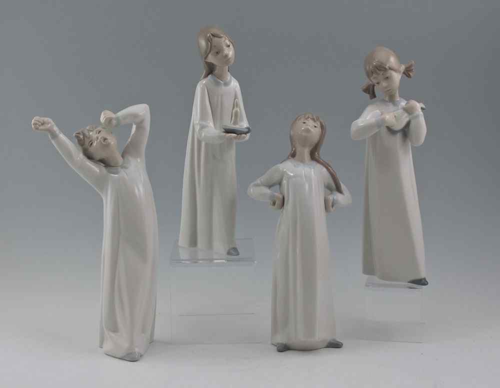 Appraisal: LLADRO PORCELAIN FIGURINES Children in Nightshirts Glazed by Fulgencio Garcia