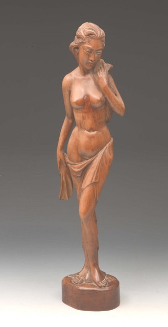 Appraisal: AN INDONESIAN CARVED WOOD MODEL OF A GIRL cm high