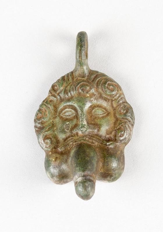 Appraisal: An erotic bronze amulet An erotic bronze amulet in ancient