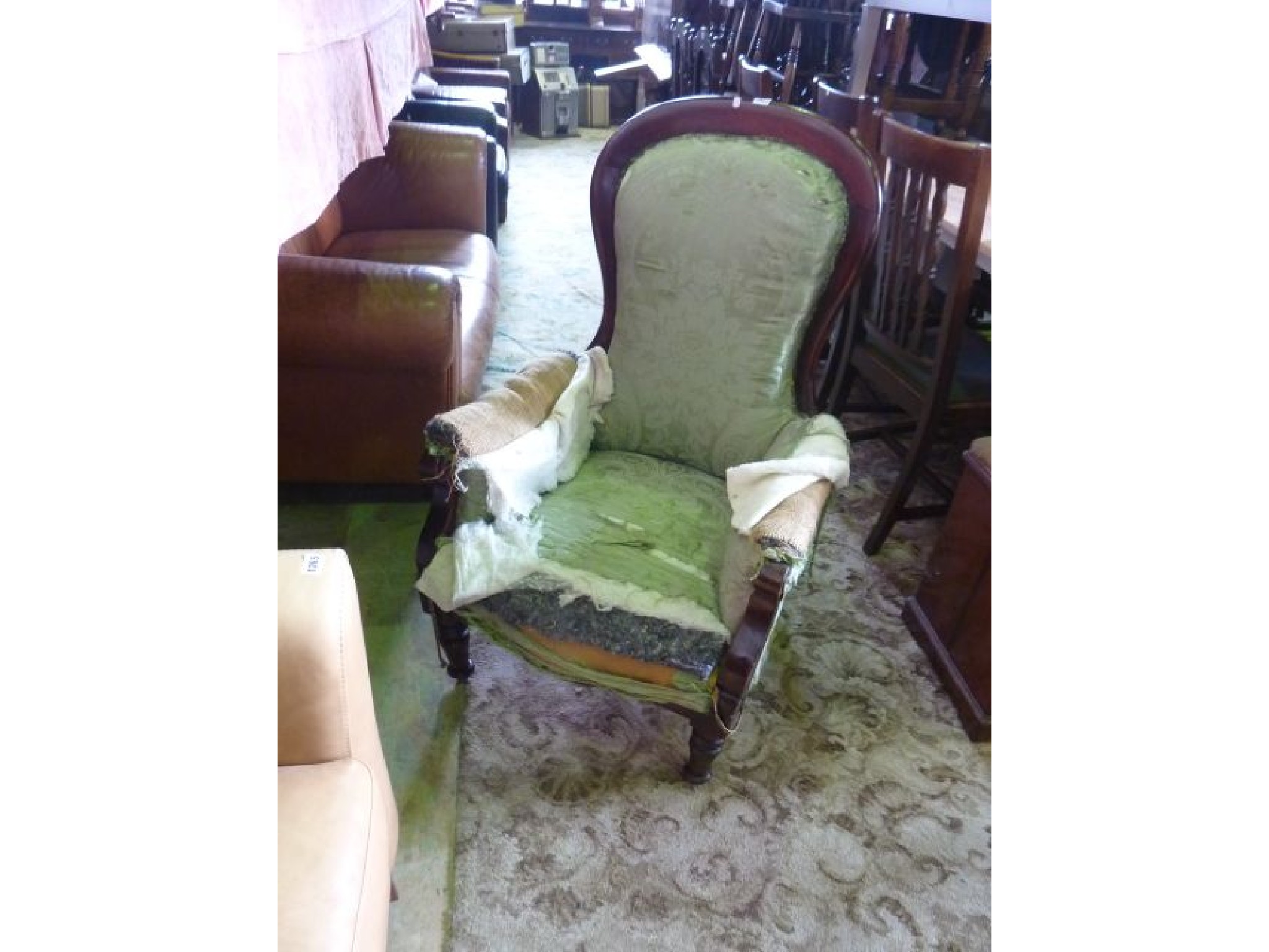 Appraisal: A Victorian drawing room chair with show wood frame and