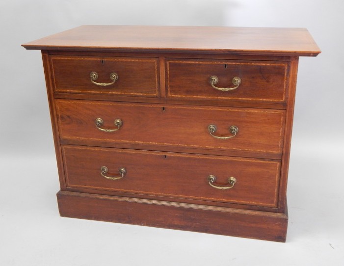 Appraisal: An Edwardian mahogany chequer banded chest of two short and