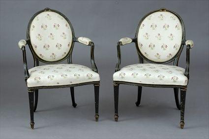 Appraisal: PAIR OF GEORGE III-STYLE CARVED AND BLACK-PAINTED ARMCHAIRS IN THE