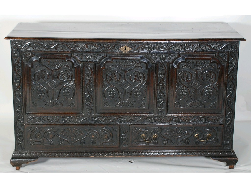 Appraisal: EARLY EIGHTEENTH CENTURY CARVED OAK DOWER CHEST the moulded plank