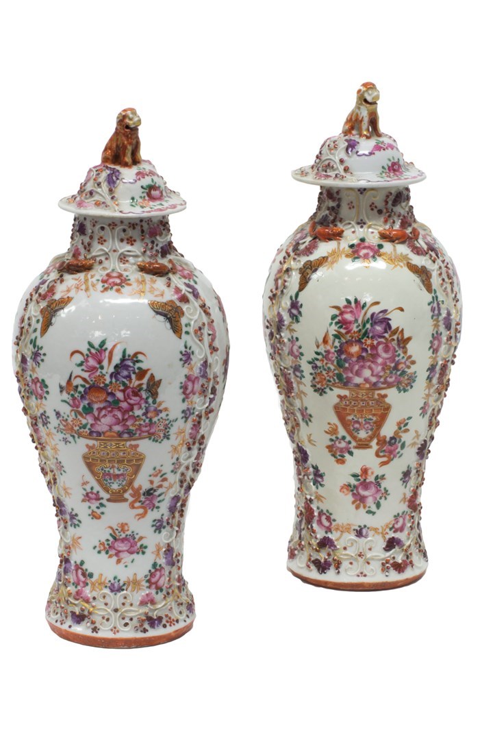 Appraisal: A pair of Chinese famille-rose baluster vases and covers Qianlong