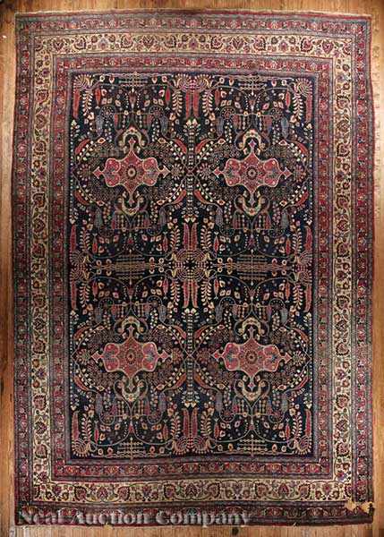 Appraisal: An Antique Persian Carpet dark blue ground with four central