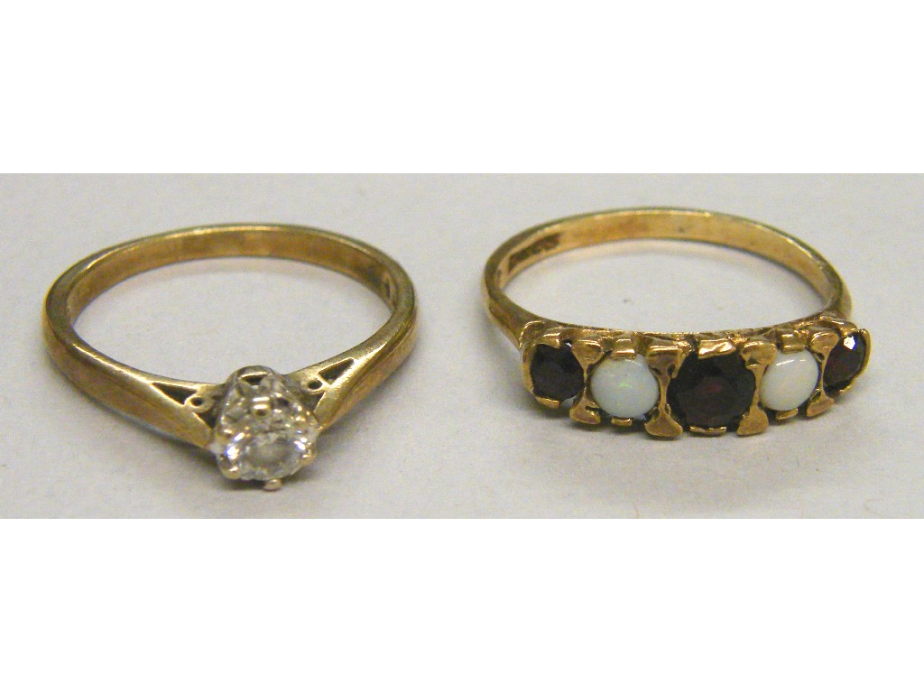 Appraisal: ct solitaire diamond ring and a ct opal and garnet