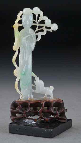 Appraisal: Chinese Qing carved jadeite Guanyin raised on a carved wood