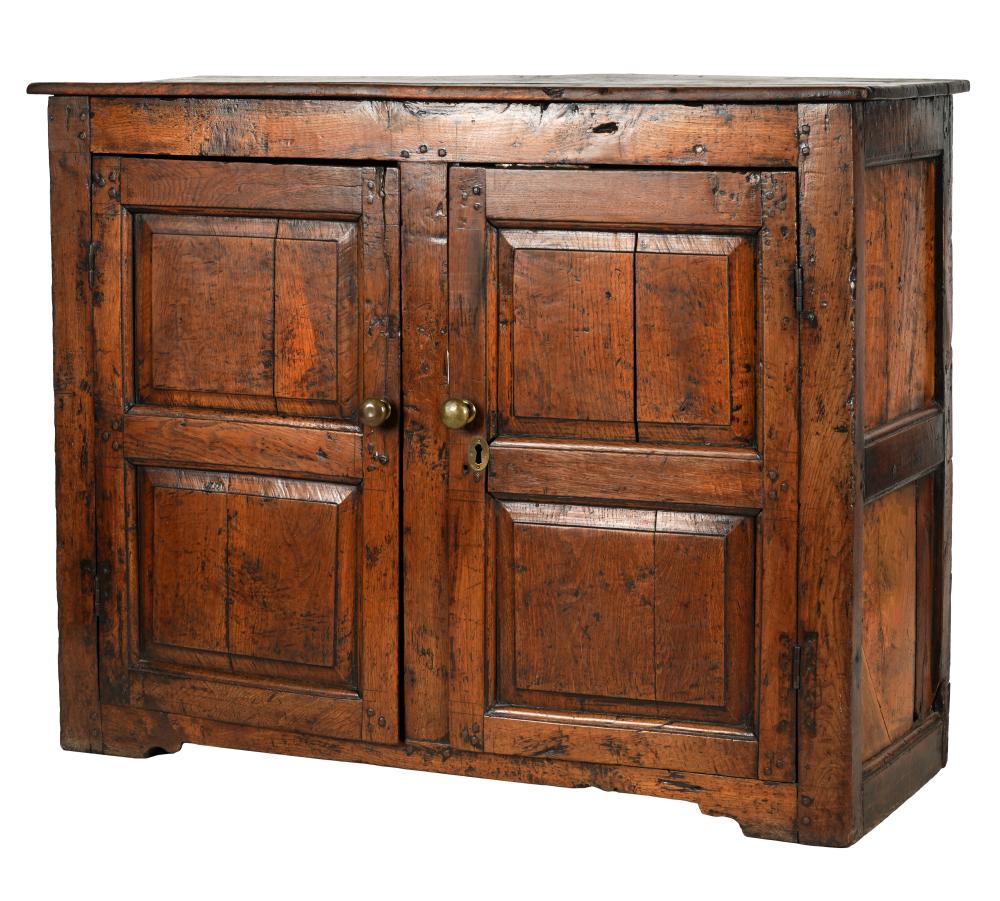 Appraisal: PANELED OAK SIDE CABINETwith brass knobs the hinged doors enclosing