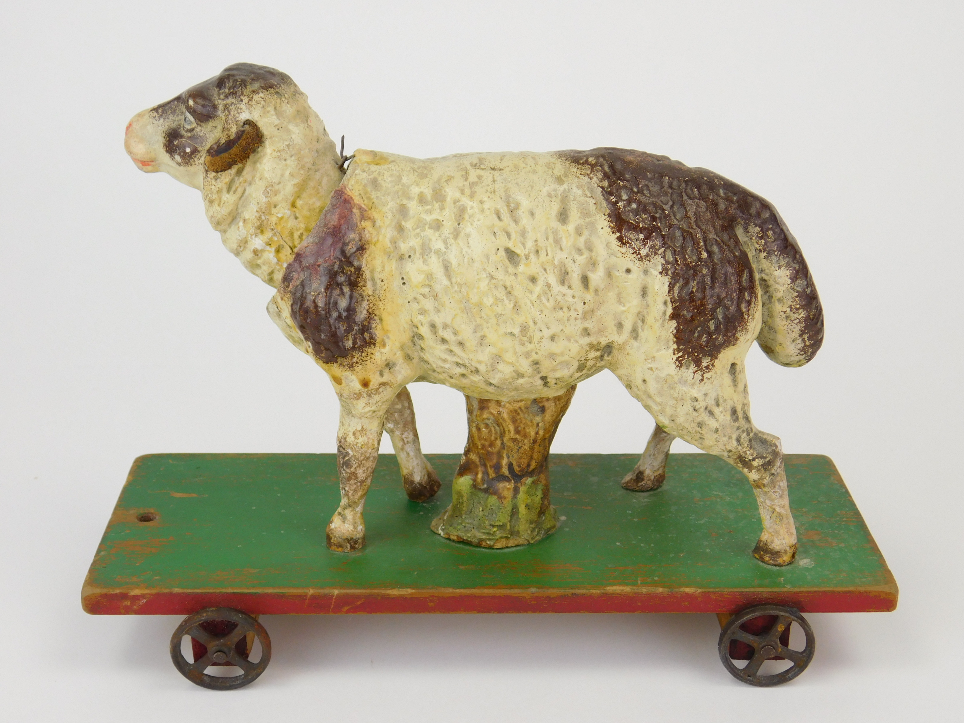 Appraisal: Vintage paper mache pull toy sheep with articulated head x