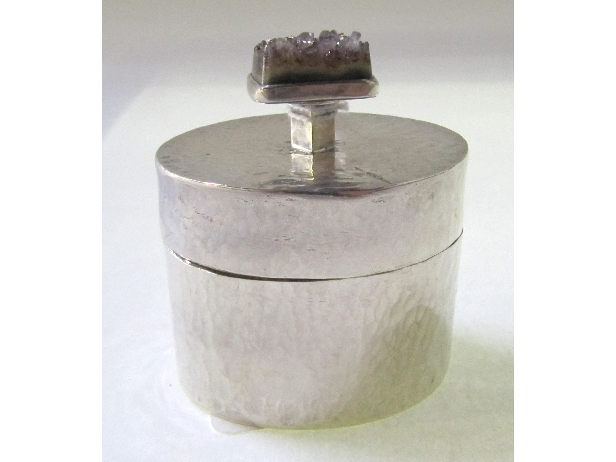 Appraisal: A Swedish hammered silver box and cover with amethyst set