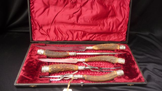 Appraisal: A cased set of carving tools with large and small