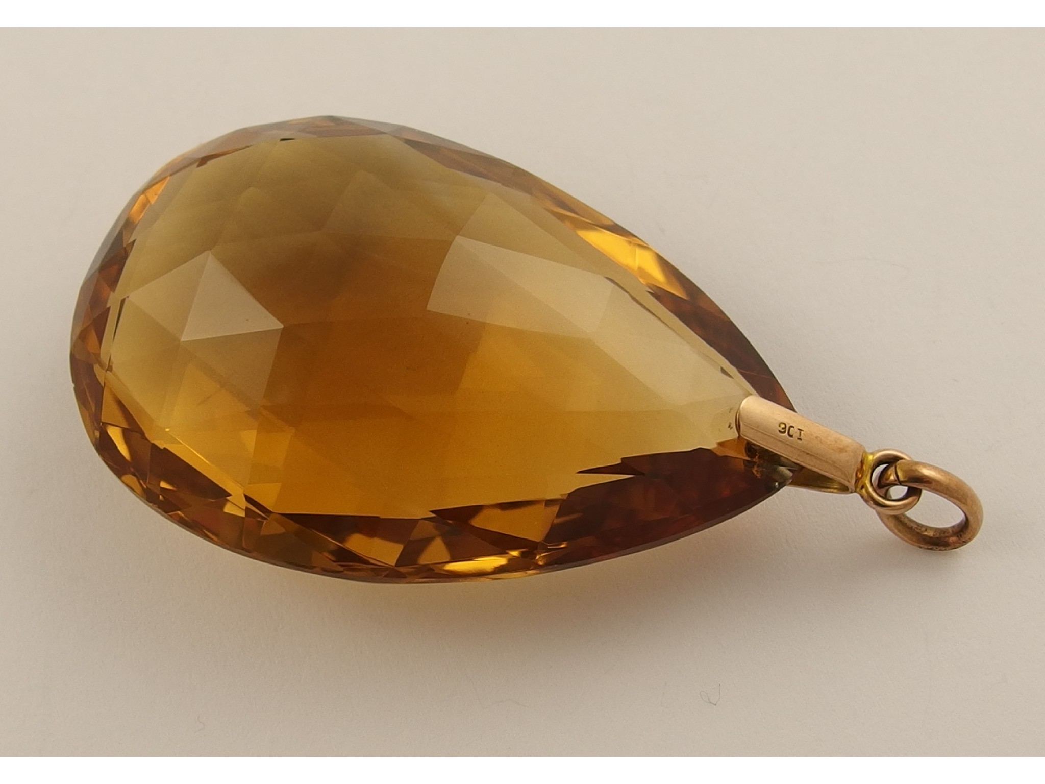 Appraisal: A large facet cut citrine pendantin an attractive deep orange