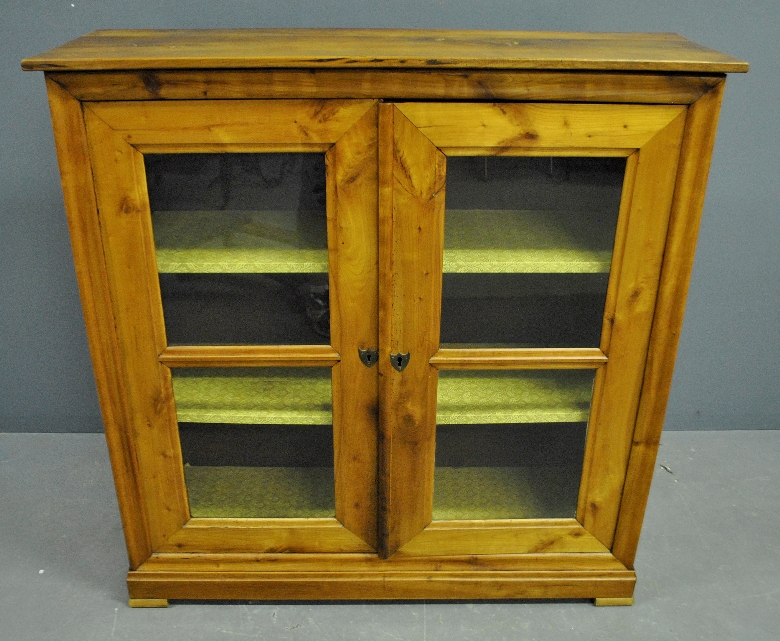 Appraisal: - Unusual applewood bookcase th c with two glass doors