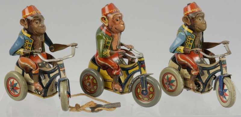 Appraisal: Lot of Tin Arnold Monkey Cycle Wind-Up Toys Description German