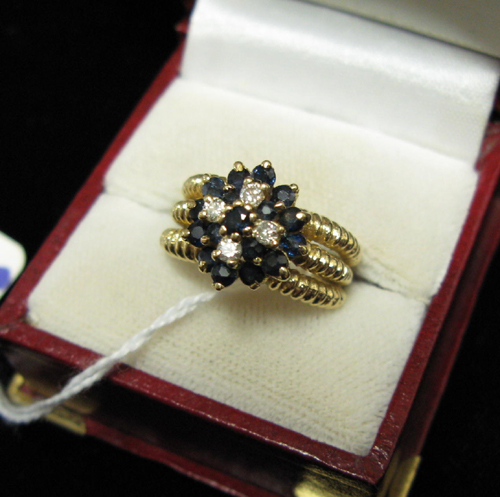 Appraisal: DIAMOND BLUE SAPPHIRE AND FOURTEEN KARAT GOLD RING having a