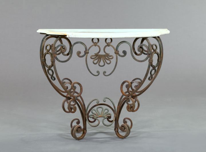 Appraisal: Wrought-Iron and Marble-Top Console Table of Mediterranean inspiration the shaped