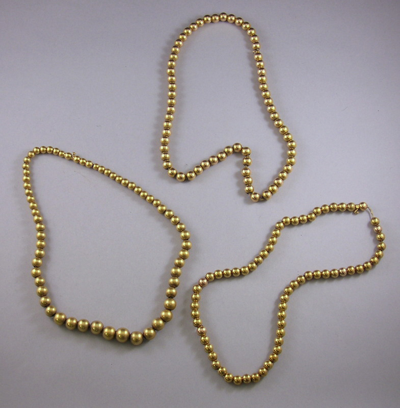 Appraisal: Three kt Gold Bead Necklaces total dwt