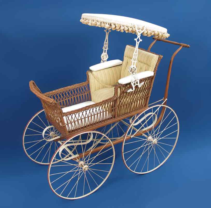 Appraisal: VICTORIAN WICKER BABY BUGGY Wrought iron and brown wicker construction