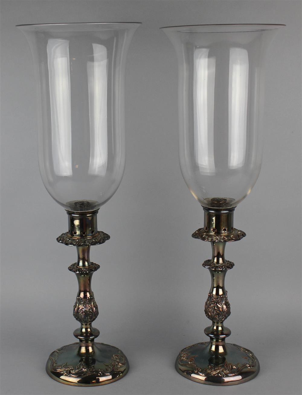 Appraisal: PAIR OF SILVERPLATED CANDLESTICKS WITH GLASS SHADES each tulip shade