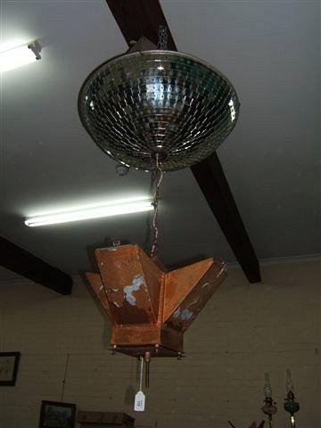 Appraisal: A theatrical lighting effect a motorised turning up-lighting lamp beneath