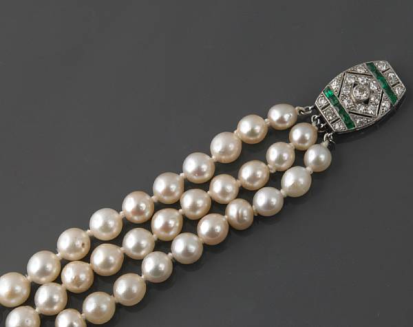 Appraisal: A three strand cultured pearl necklace with a diamond emerald