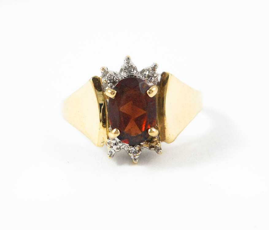 Appraisal: RED GEMSTONE DIAMOND AND TEN KARAT GOLD RING with one