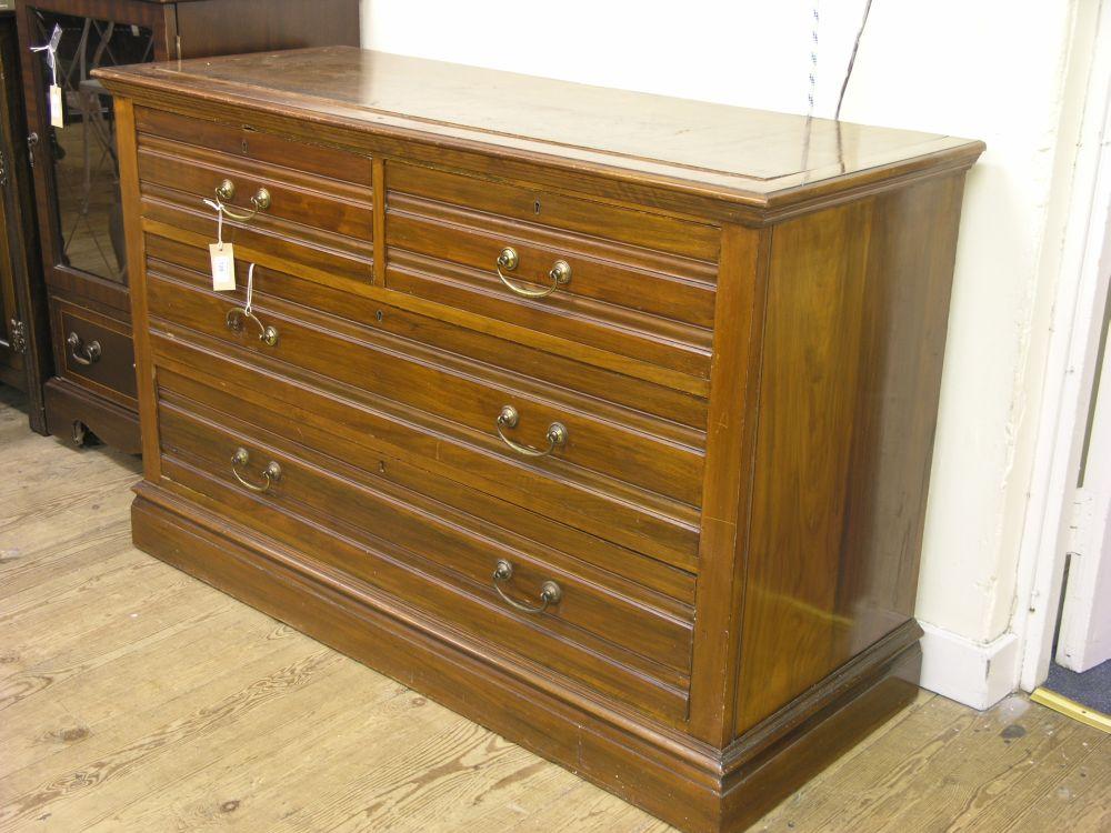 Appraisal: An Edwardian walnut chest of two short and two long