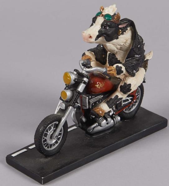 Appraisal: Highway Holsteins Cow On Motorcycle Figurine This resin sculpture shows