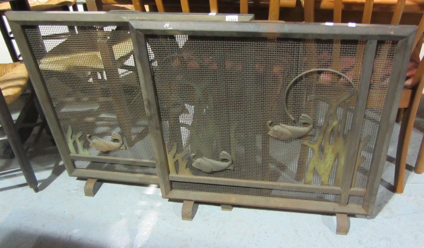 Appraisal: A pair of brass fire screens with fish decoration