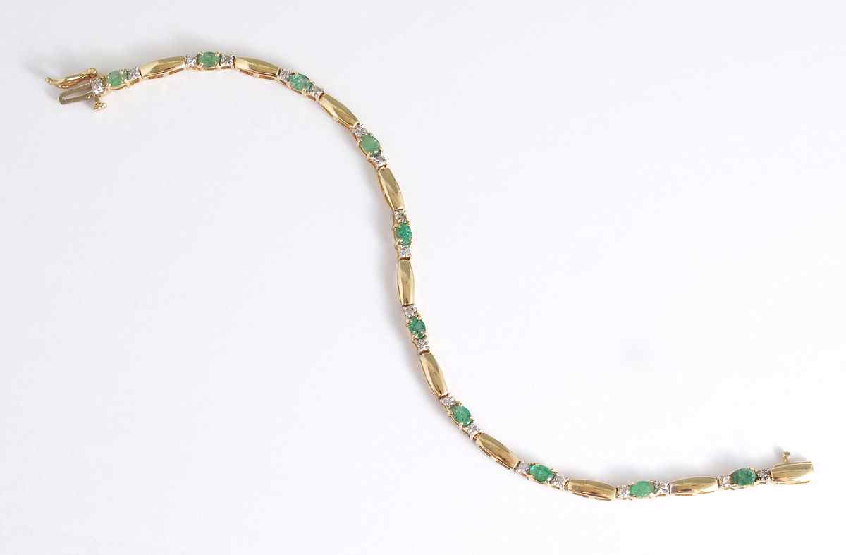 Appraisal: K EMERALD DIAMOND BRACELET K yellow gold bracelet contains oval